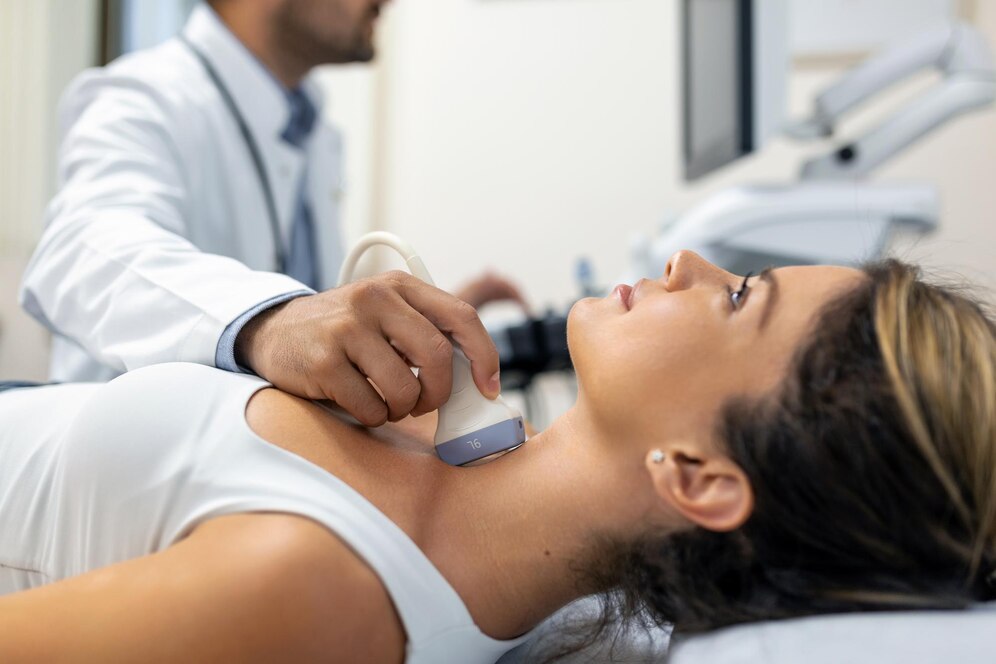 close up shot young woman getting her neck examined by doctor using ultrasound scanner modern clinic_657921 843