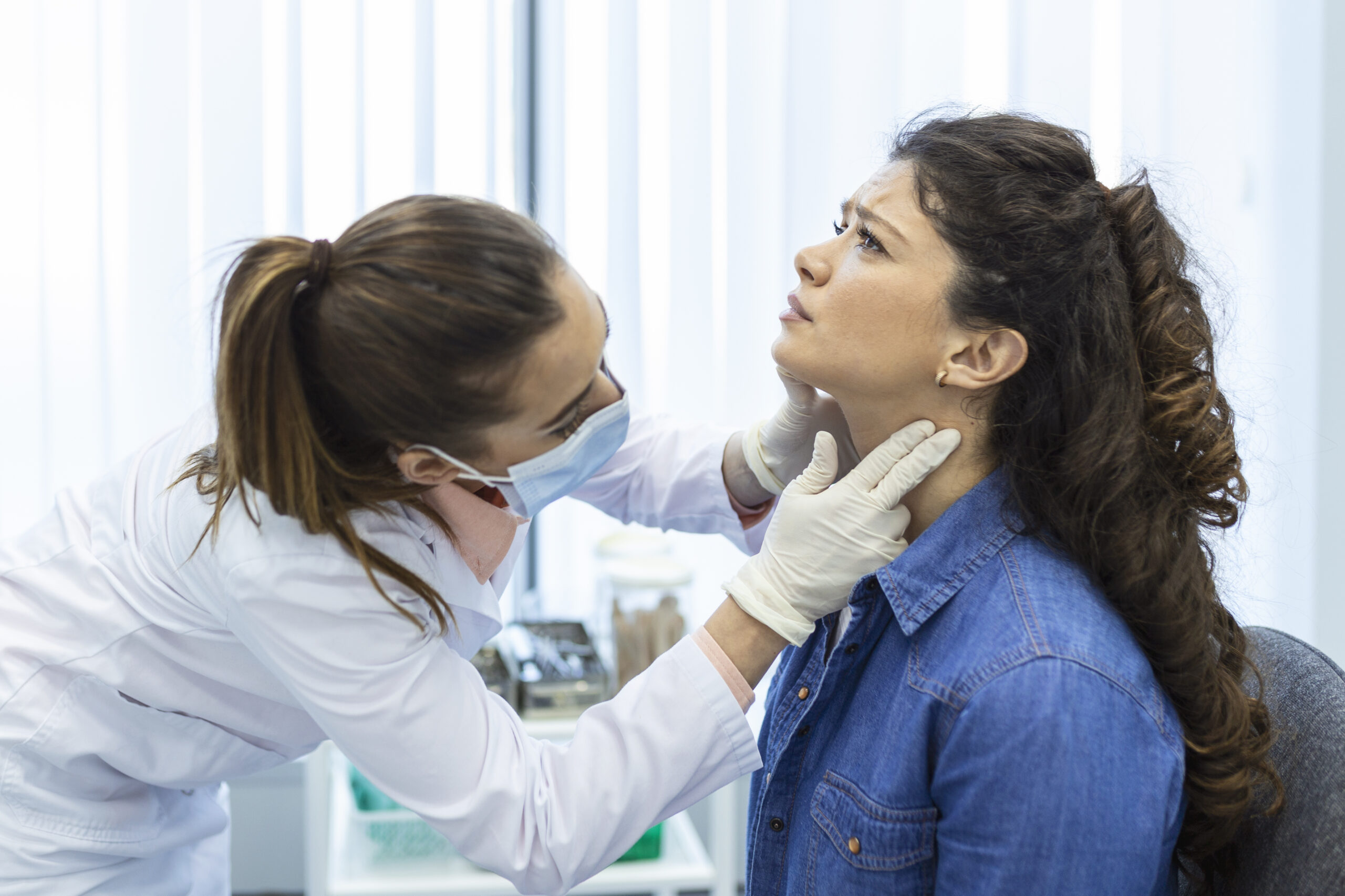 endocrinologist examining throat young woman clinic women with thyroid gland test endocrinology hormones treatment inflammation sore throat scaled